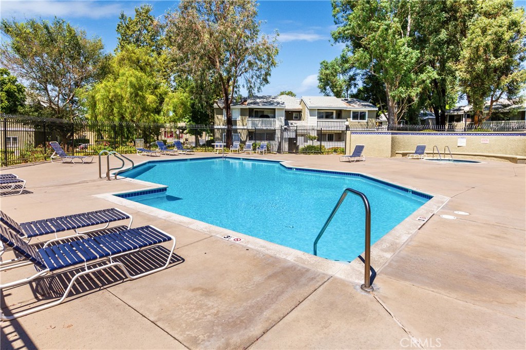 27668 Haskell Canyon Road, Unit H Saugus, CA 91350 - Photo 18 of 18 a view of a swimming pool with an outdoor seating