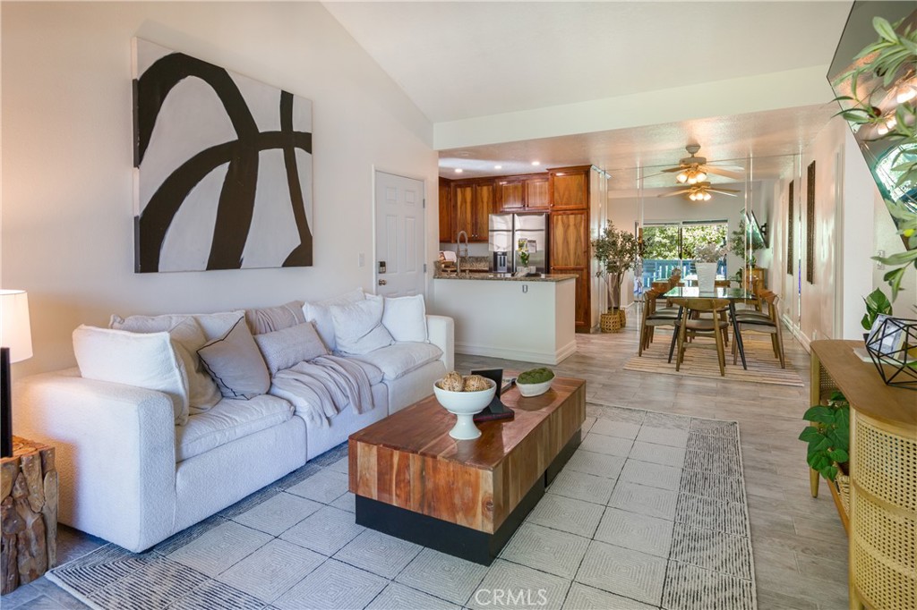 27668 Haskell Canyon Road, Unit H Saugus, CA 91350 - Photo 7 of 18 a living room with furniture and a large window