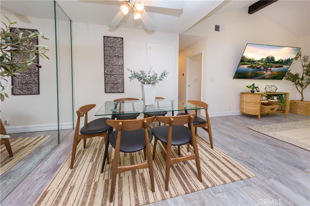27668 Haskell Canyon Road, Unit H Saugus, CA 91350 - Photo 10 of 18 a view of a dining room with furniture and wooden floor