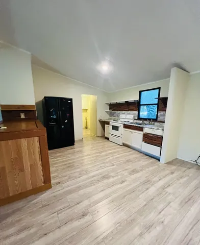 a spacious bathroom with a double vanity sink and a mirror