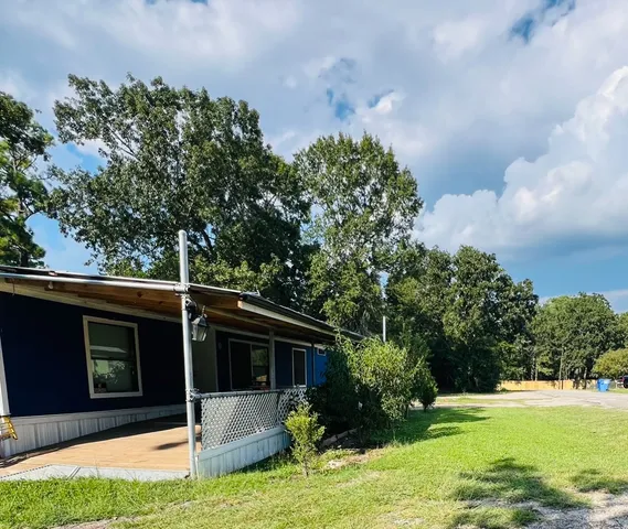 a swimming pool with wooden fence