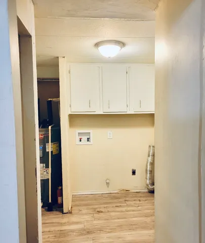 a view of a kitchen with wooden floor