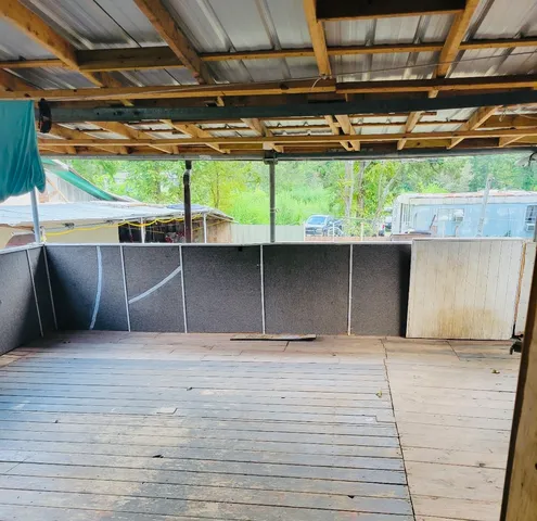 a view of a garage with wooden wall
