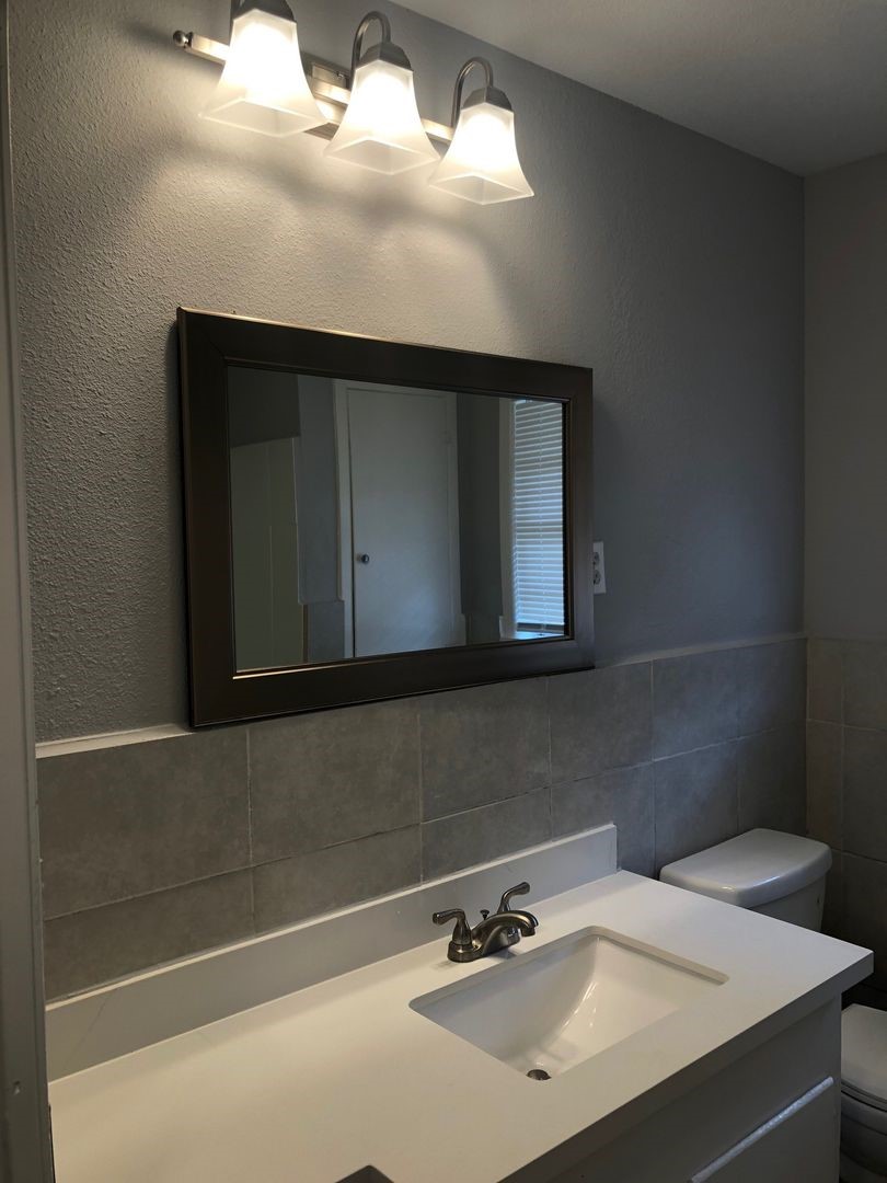 503 Willow Avenue Cleveland, TX 77327 - Photo 11 of 17 a bathroom with a sink and a mirror