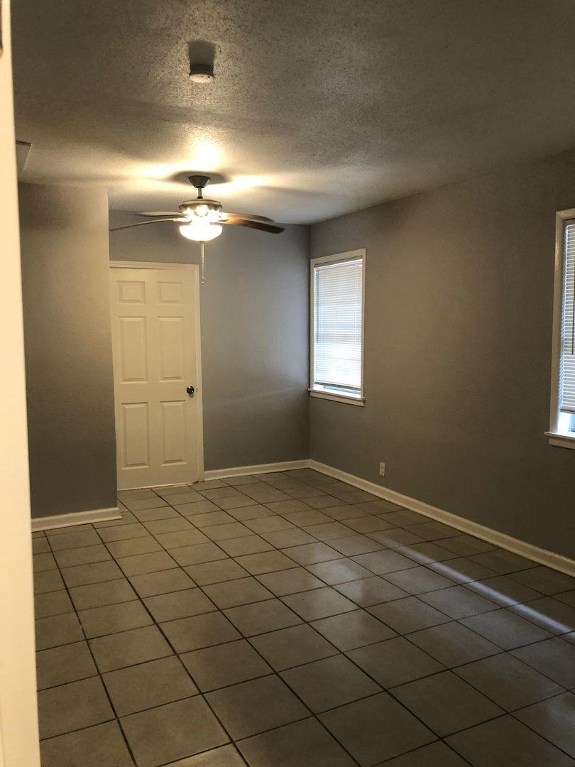 503 Willow Avenue Cleveland, TX 77327 - Photo 2 of 17 a view of empty room with window