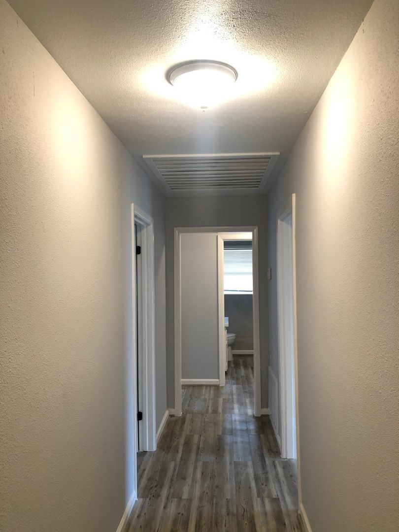 503 Willow Avenue Cleveland, TX 77327 - Photo 10 of 17 a view of hallway with wooden floor