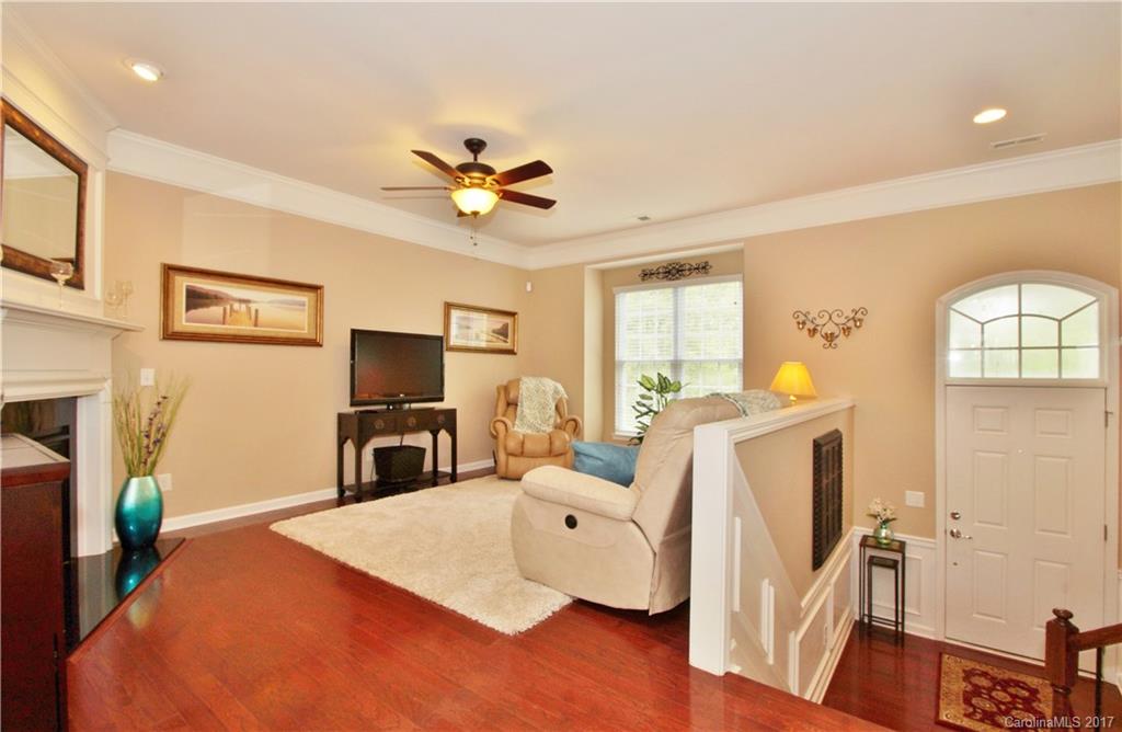 1116 Drayton Court Fort Mill, SC 29708 - Photo 3 of 19 a living room with furniture a fireplace and a flat screen tv