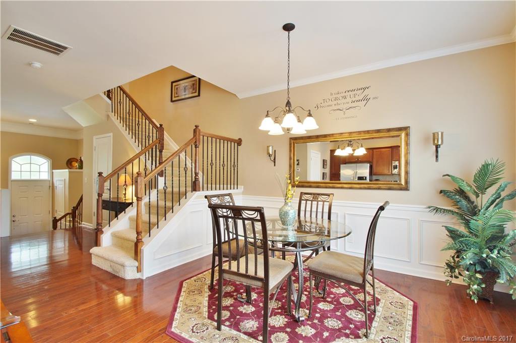 1116 Drayton Court Fort Mill, SC 29708 - Photo 5 of 19 a view of a livingroom and dining room with furniture wooden floor a chandelier