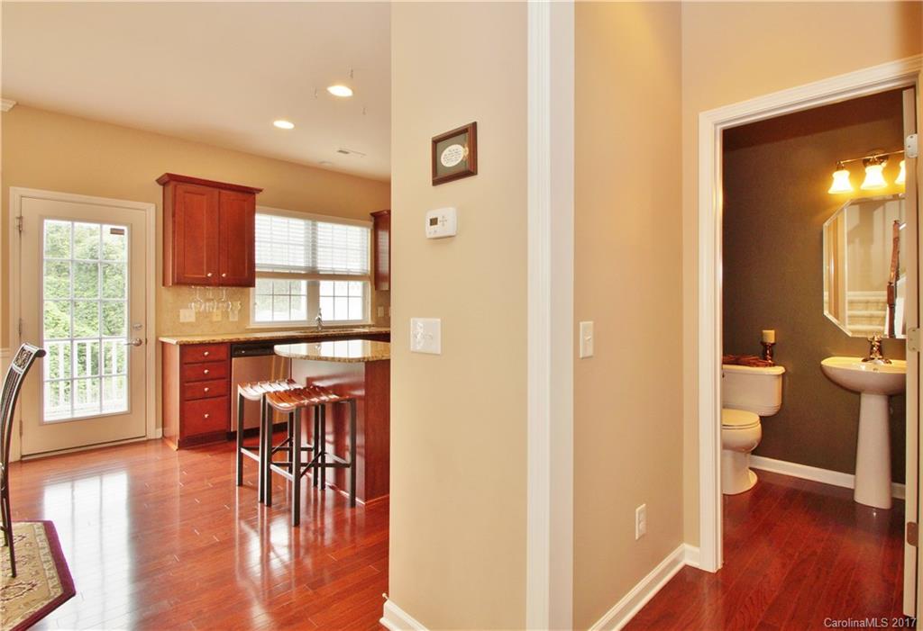 1116 Drayton Court Fort Mill, SC 29708 - Photo 8 of 19 a view of a hallway with wooden floor windows and a livingroom