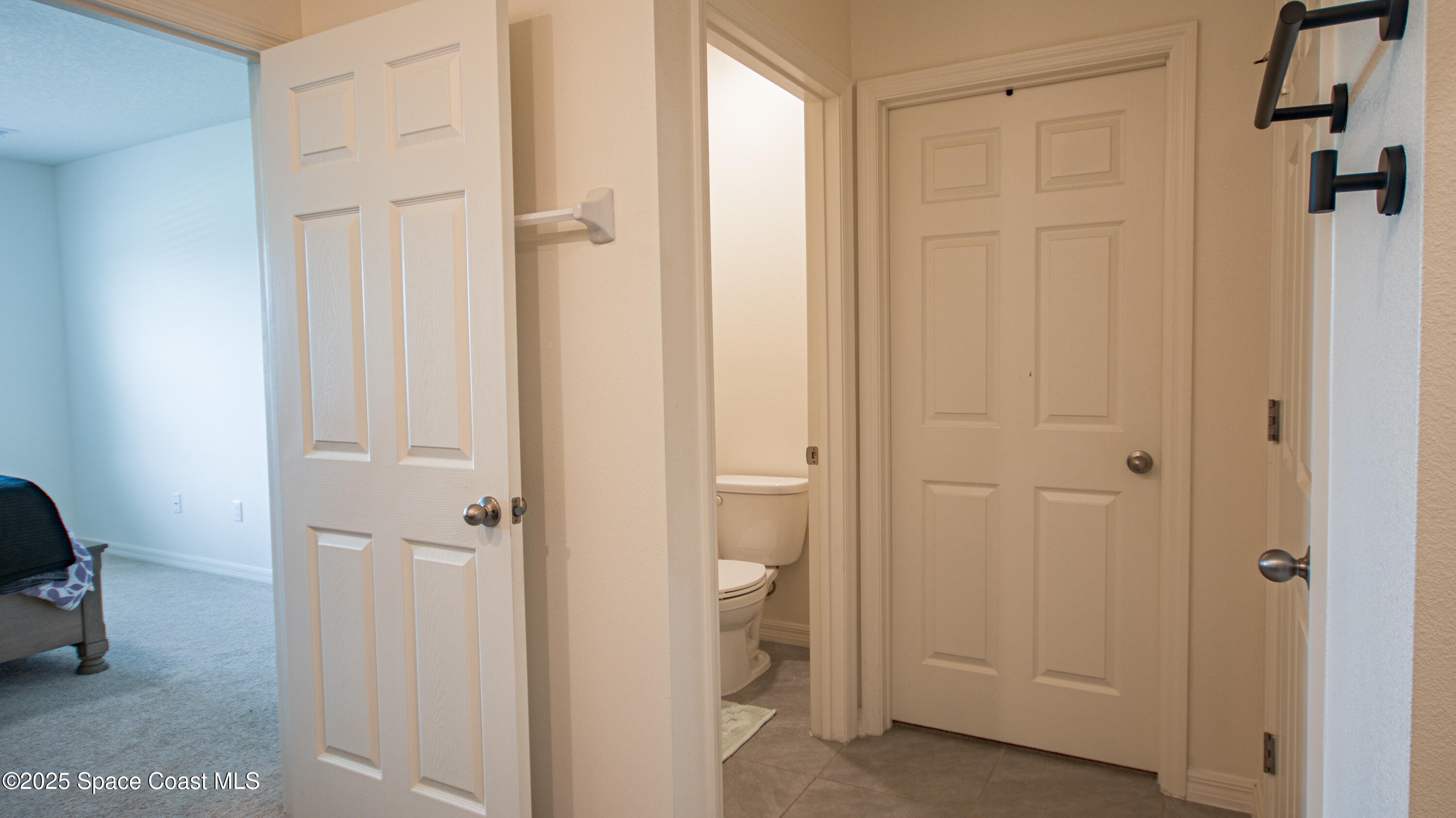 913 Trinity Street Rockledge, FL 32955 - Photo 15 of 25 a bathroom with a shower and a toilet