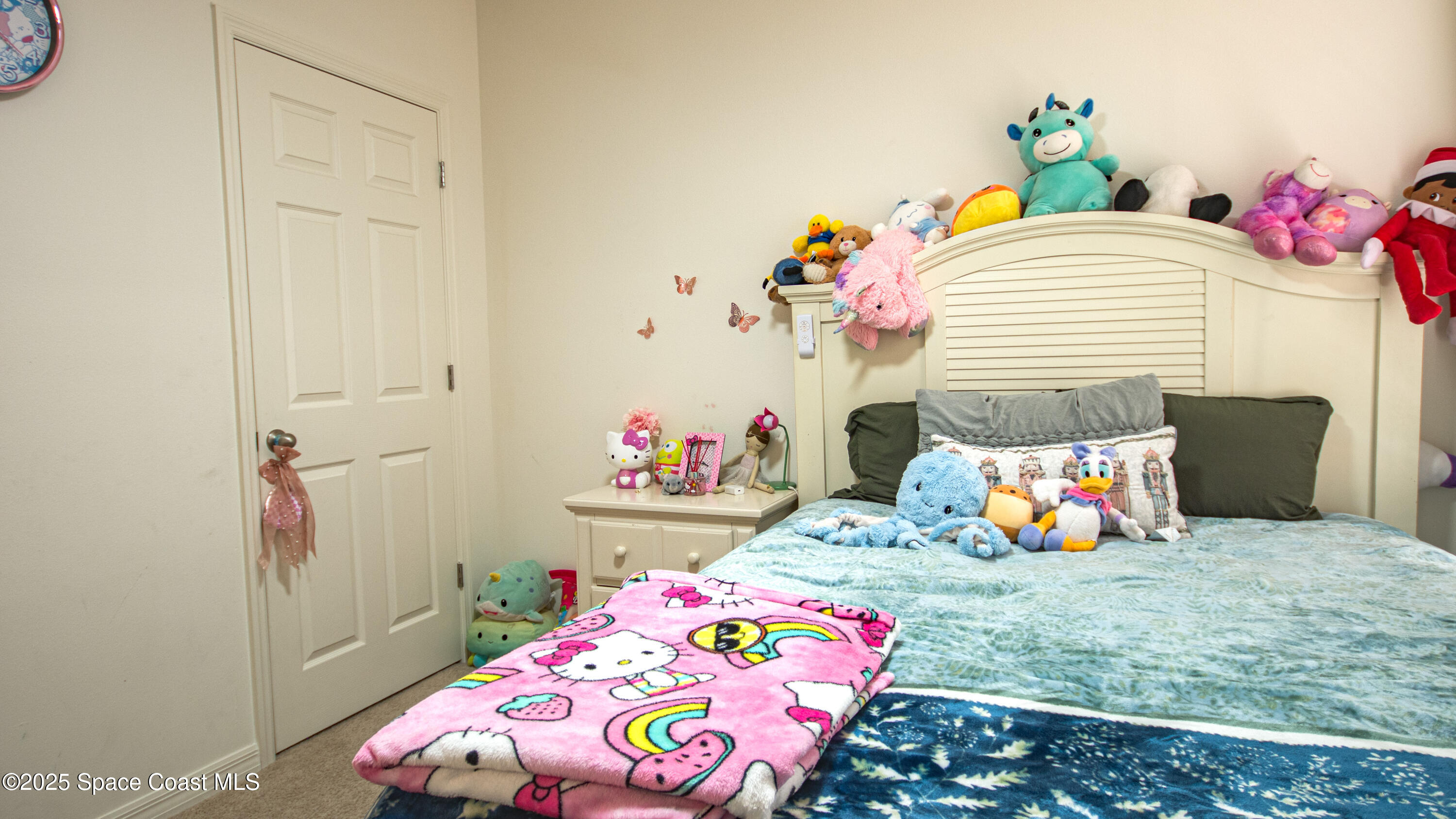 913 Trinity Street Rockledge, FL 32955 - Photo 17 of 25 a bedroom with a bed and a dresser