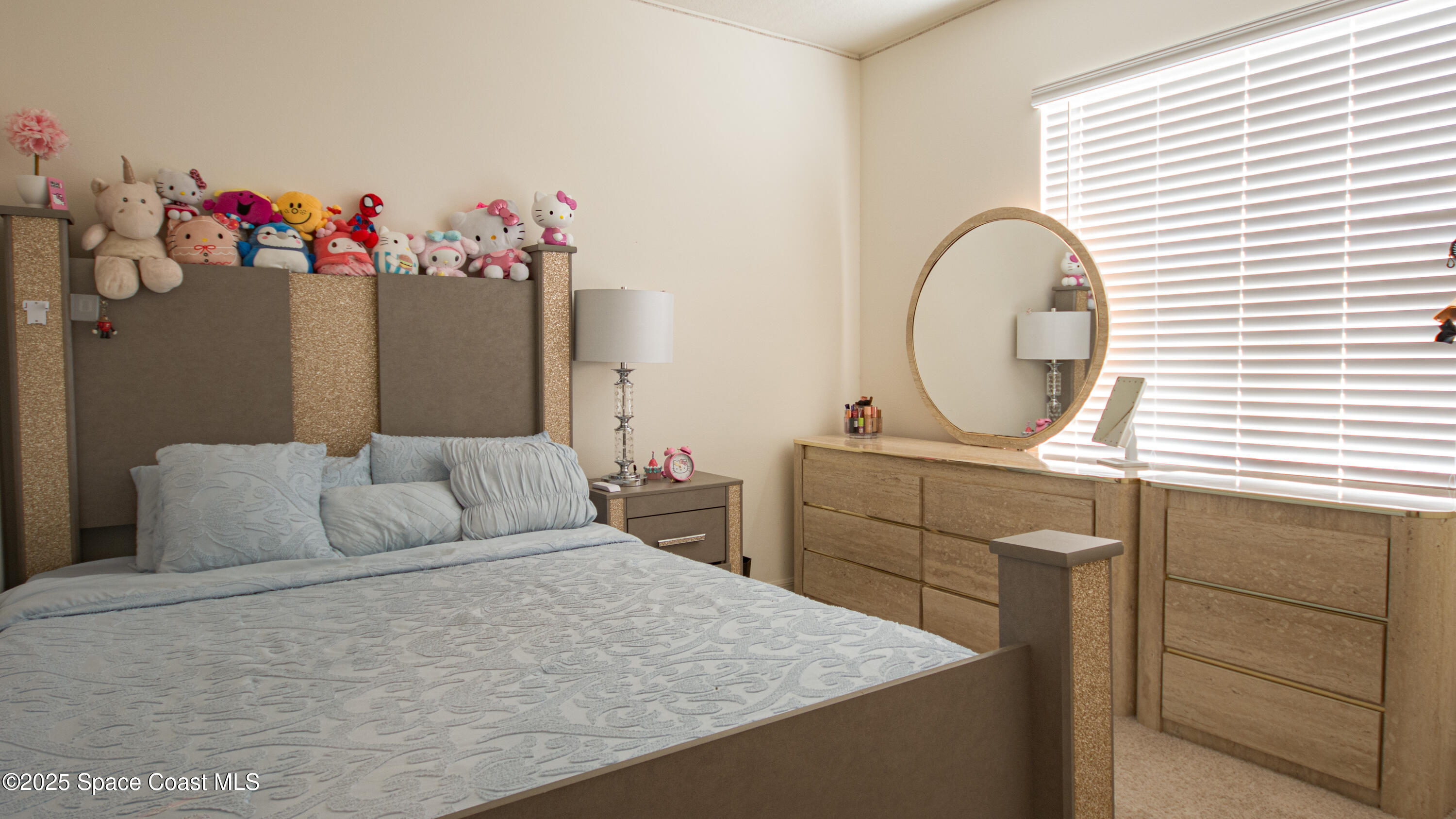 913 Trinity Street Rockledge, FL 32955 - Photo 18 of 25 a bedroom with a bed and a dresser