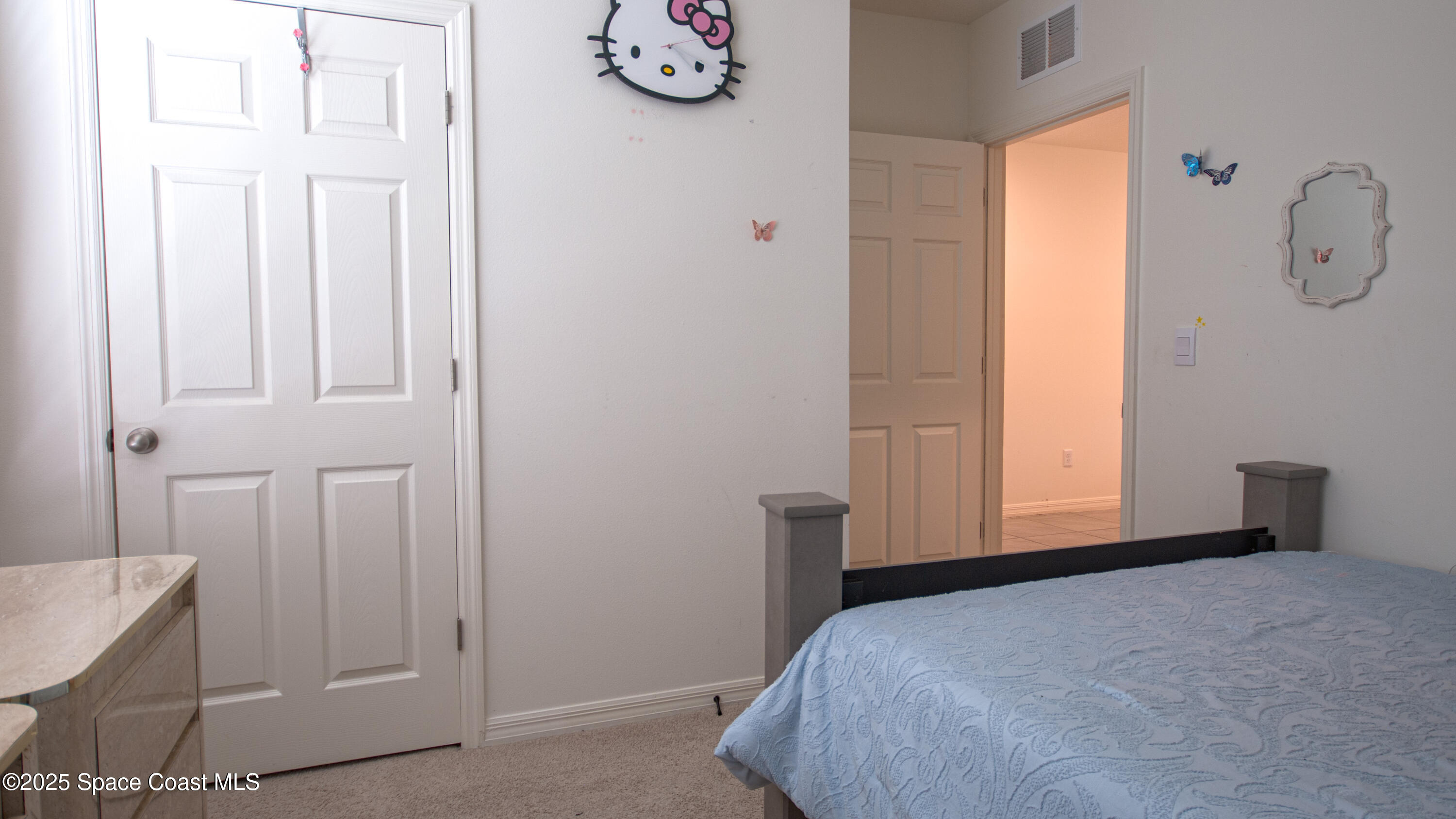 913 Trinity Street Rockledge, FL 32955 - Photo 19 of 25 a bedroom with a bed and a window