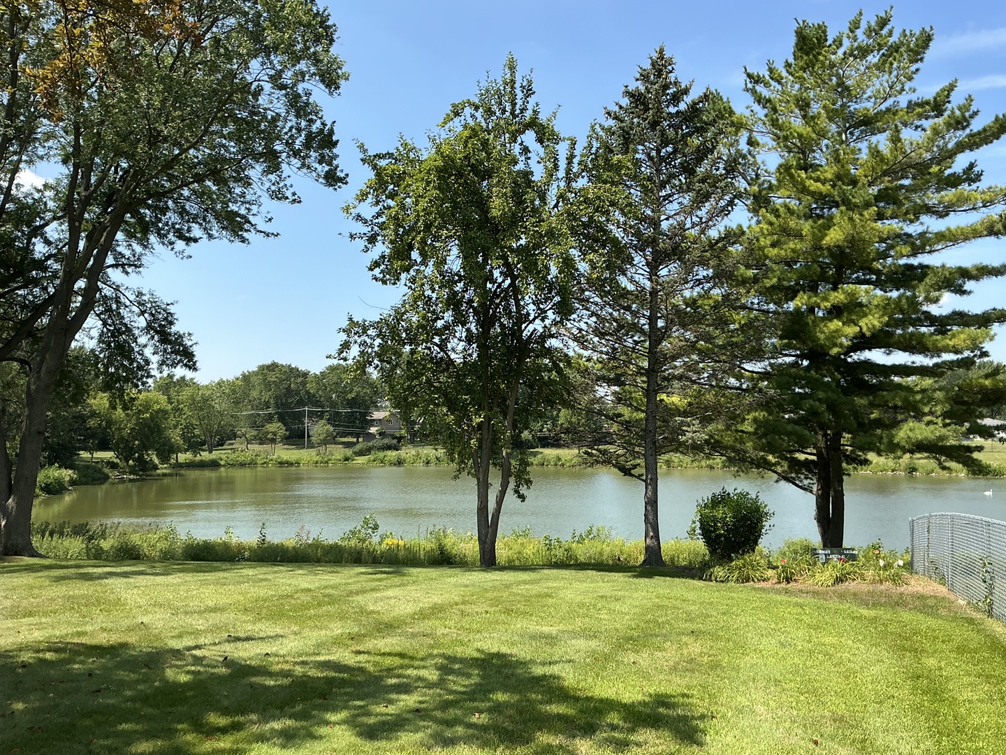 1930 North Lakeside Plaza Hoffman Estates, IL 60169 - Photo 15 of 15 a garden with trees in front of it