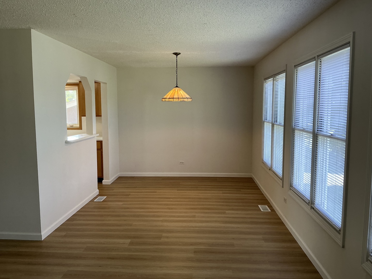 1930 North Lakeside Plaza Hoffman Estates, IL 60169 - Photo 5 of 15 a view of a room with wooden floor and a window