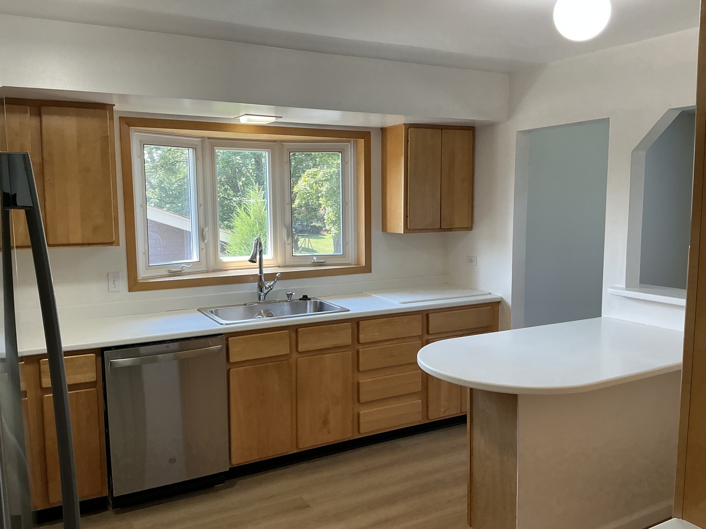 1930 North Lakeside Plaza Hoffman Estates, IL 60169 - Photo 7 of 15 a kitchen with a sink and wooden cabinets