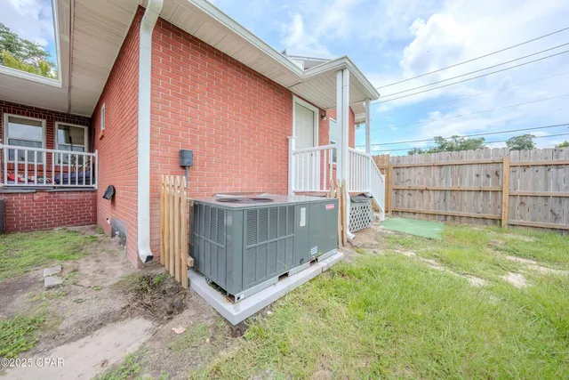a view of yard with swimming pool and green space