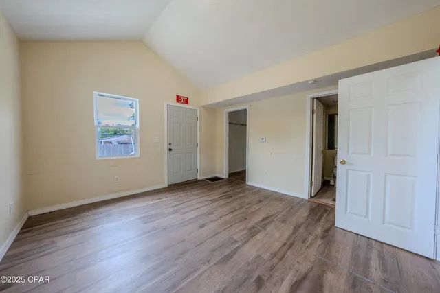 a kitchen with wooden floors and sink