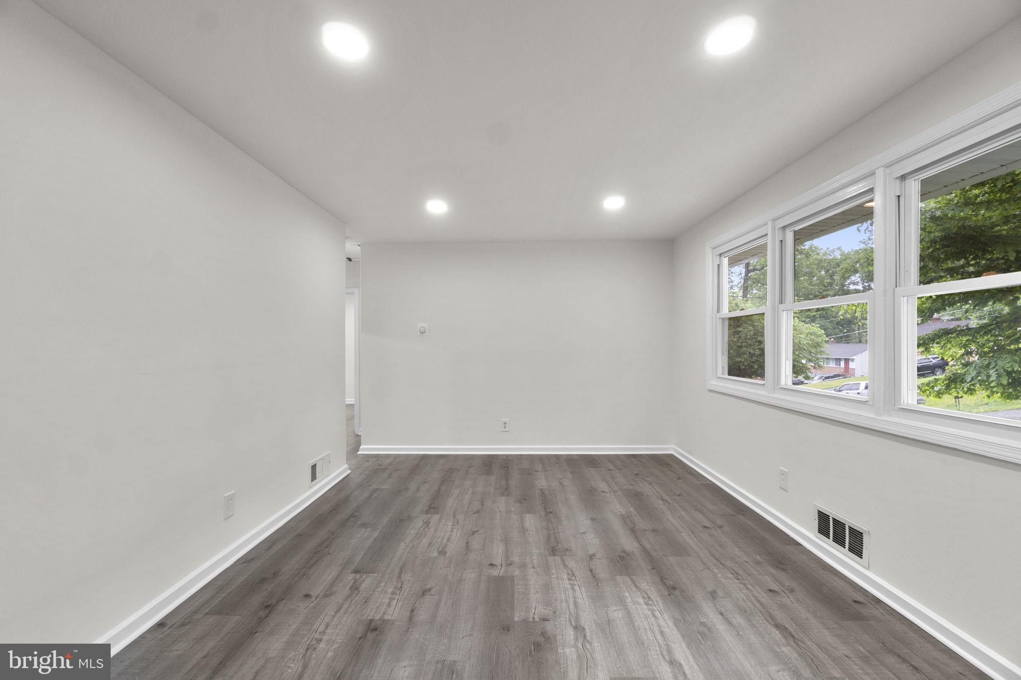 3658 Clifmar Road Baltimore, MD 21244 - Photo 3 of 43 a view of a room with wooden floor and windows