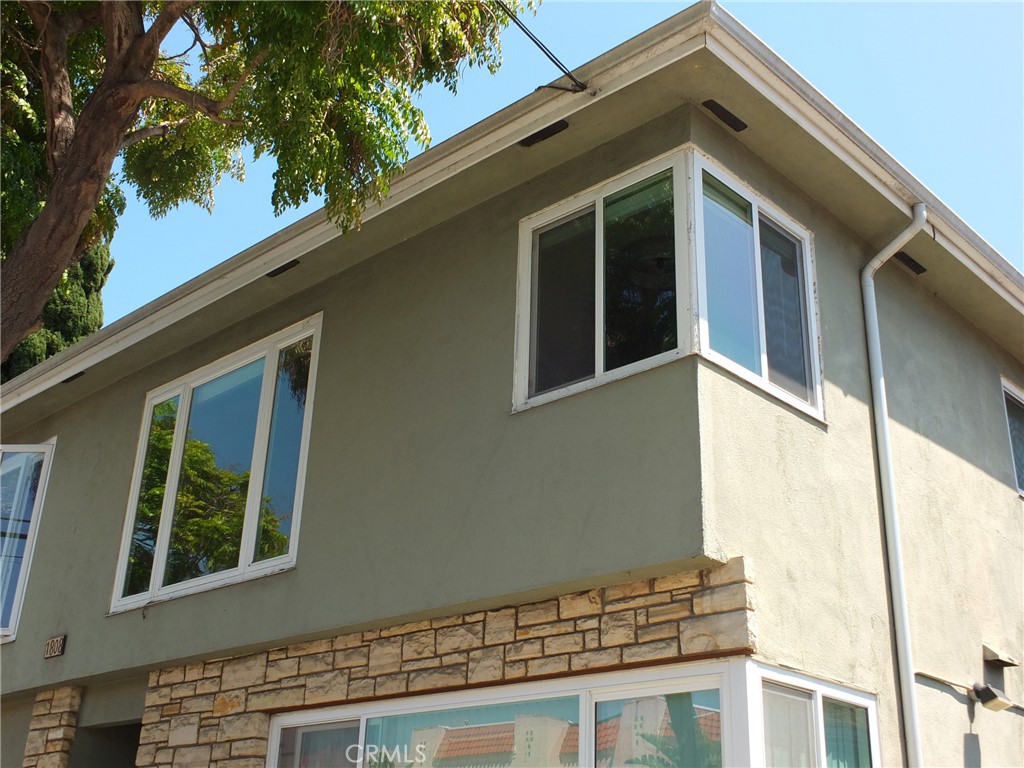 1808 East Appleton Street, Unit 7 Long Beach, CA 90802 - Photo 2 of 44 a front view of a house with a garage