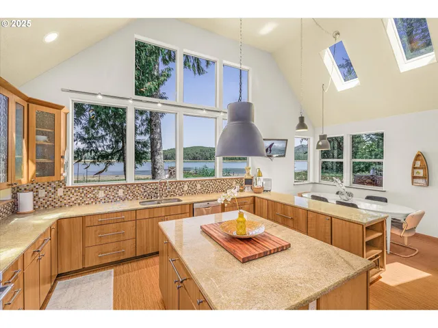 a kitchen with a stove a sink and a wooden cabinets