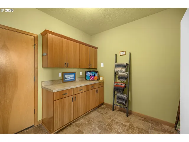 a kitchen with a refrigerator and a sink