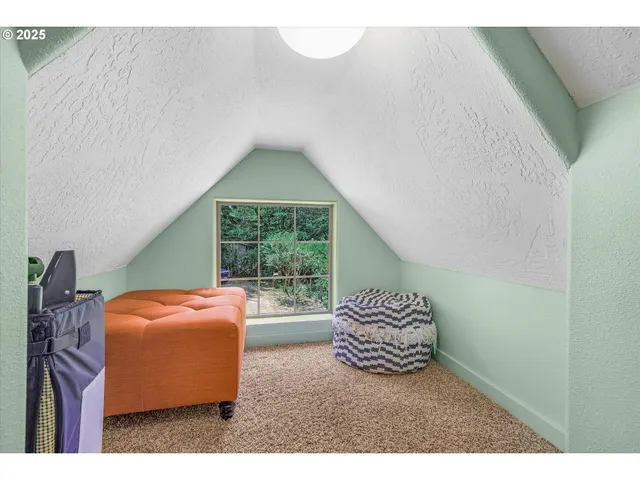 a bedroom with furniture and a window