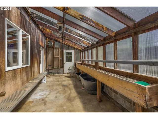 a view of a porch with furniture and a window