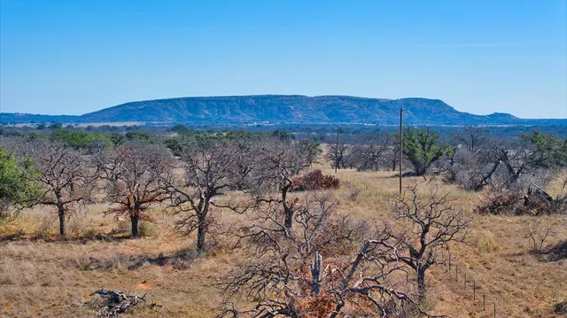 a view of a dry yard with mountain