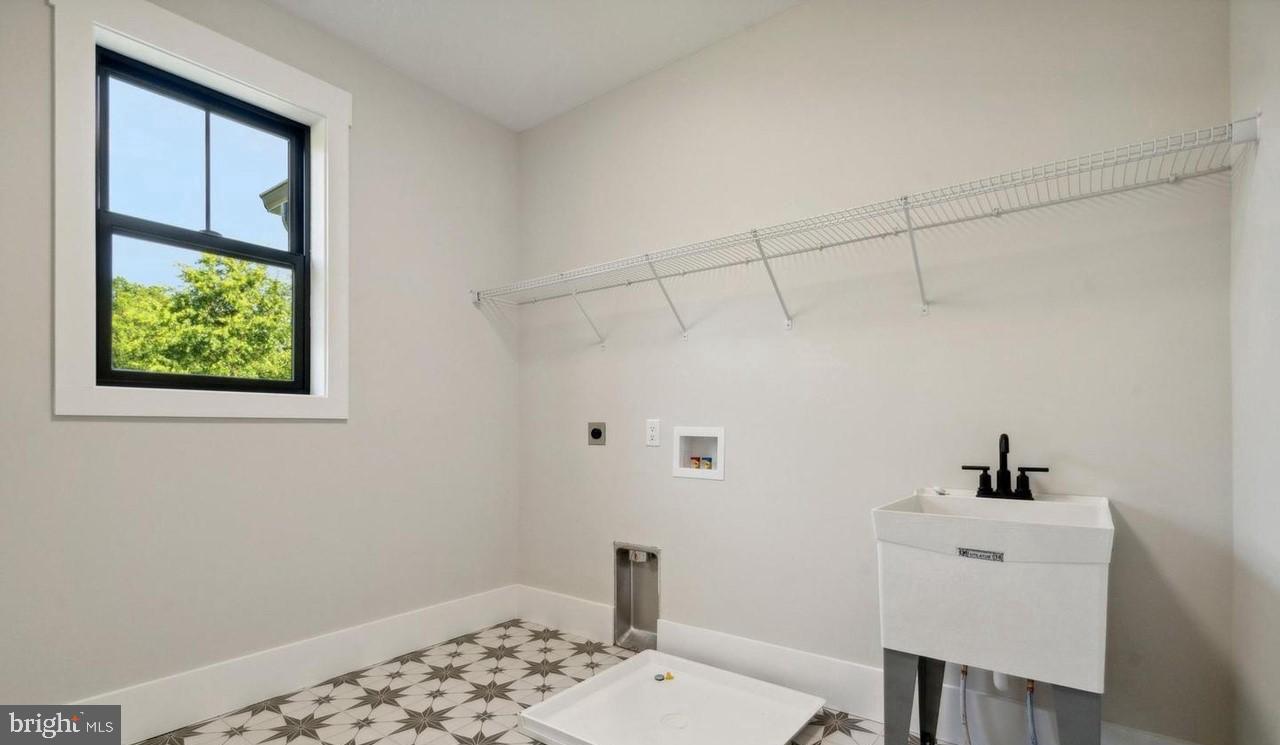 688 Cathcart Road Blue Bell, PA 19422 - Photo 68 of 81 Upstairs Laundry Rm - laundry sink, upgraded tile
