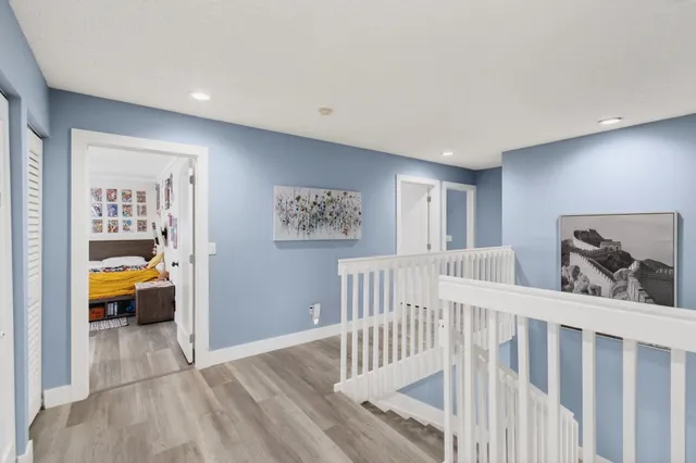 a view of hallway with livingroom and furniture