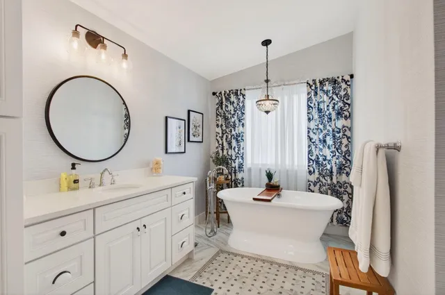 a bedroom with a bed and a desk in it