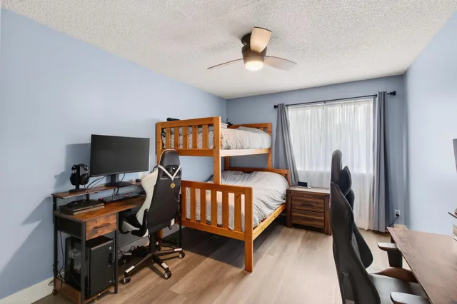 a view of a house with swimming pool patio and a garden