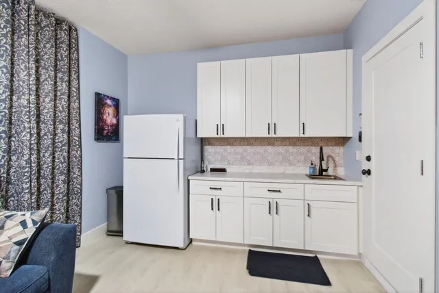 swimming pool view with a seating space