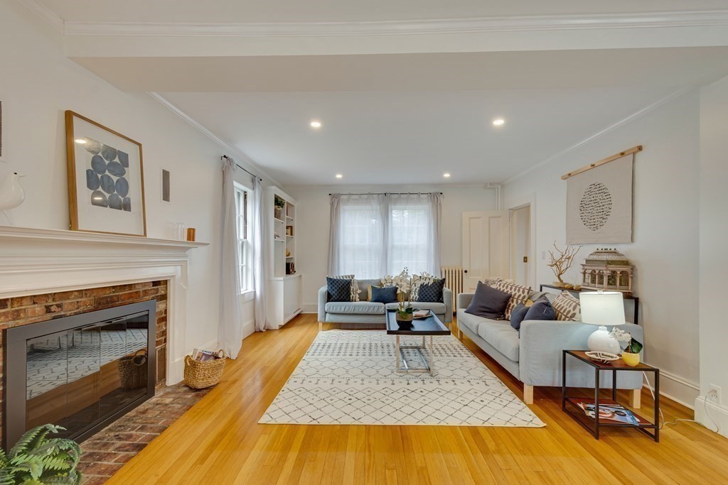 38 Lincoln Road Lincoln, MA 01773 - Photo 8 of 38 a living room with furniture and a fireplace