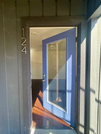 a view of entryway with wooden floor
