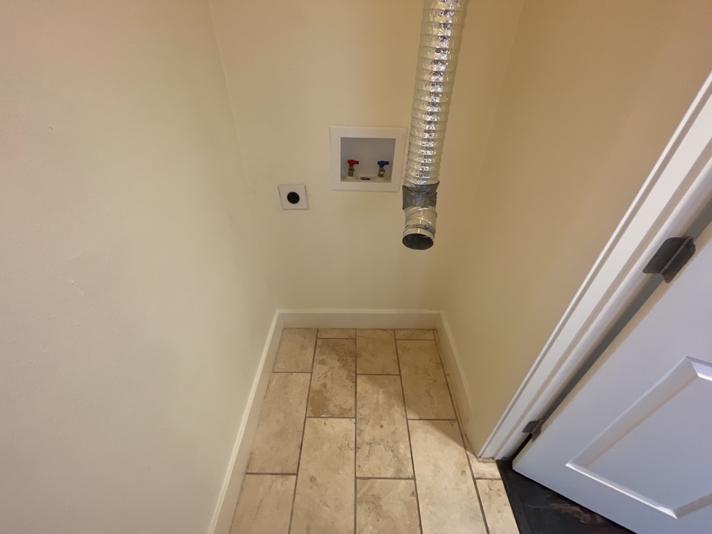 909 Reinli Street, Unit 124 Austin, TX 78751 - Photo 11 of 12 Laundry area with washer hookup and electric dryer hookup