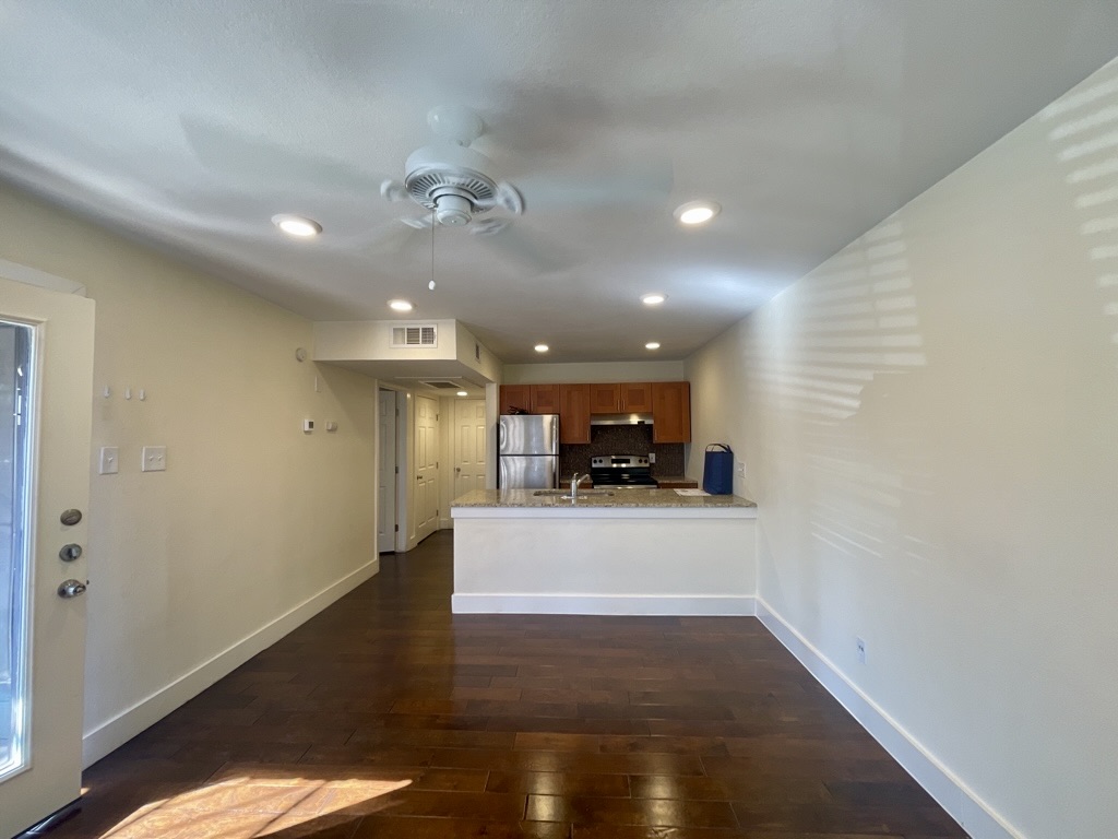 909 Reinli Street, Unit 124 Austin, TX 78751 - Photo 4 of 12 Living room featuring dark wood-style floors, ceiling fan, and recessed lighting