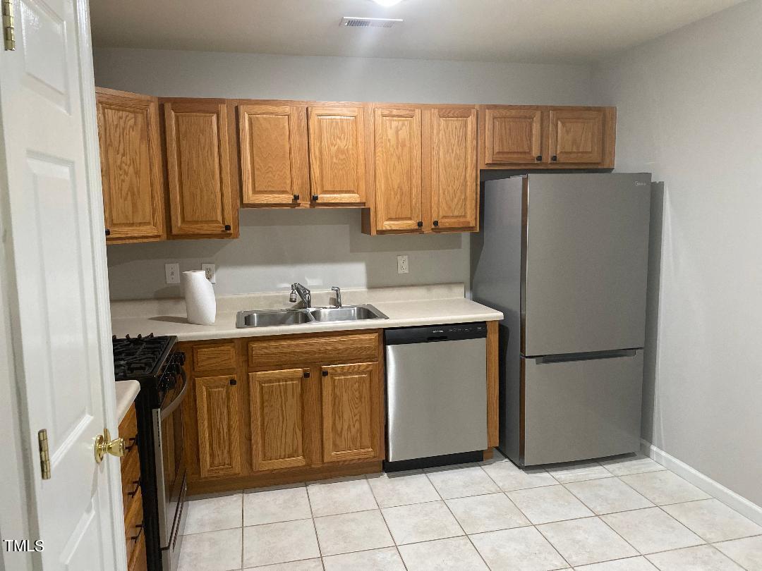 8630 Neuse Landing Lane, Unit 107 Raleigh, NC 27616 - Photo 8 of 26 8630NeuseLandingKitchenA