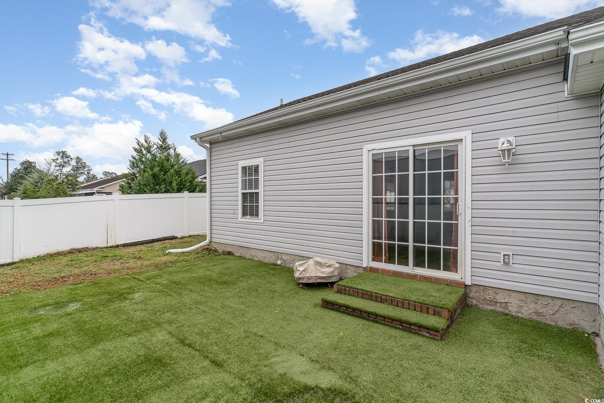 9545 Sullivan Drive Murrells Inlet, SC 29576 - Photo 27 of 30 Exterior space with a lawn