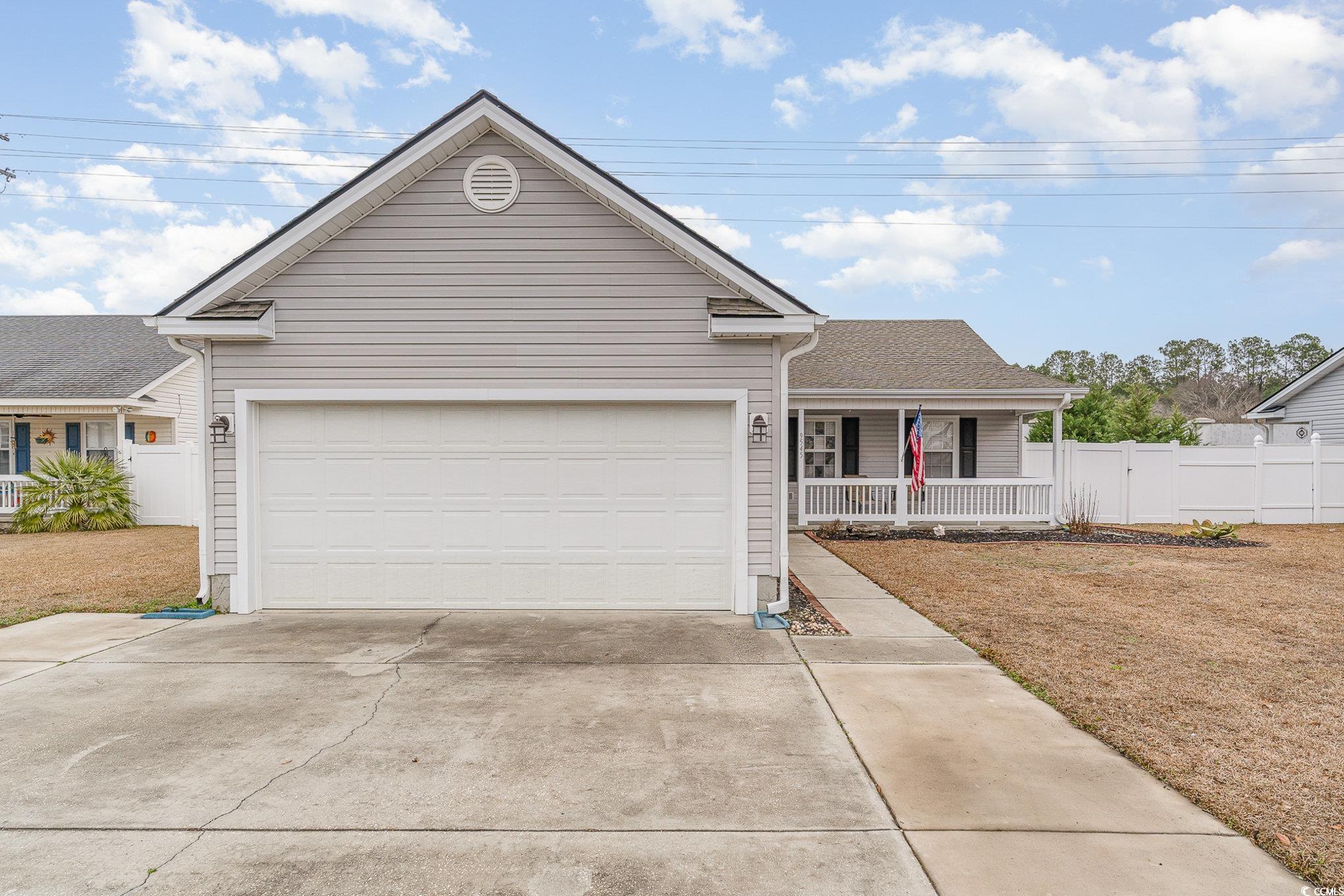 9545 Sullivan Drive Murrells Inlet, SC 29576 - Photo 3 of 30 View of front of home with a porch and a garage