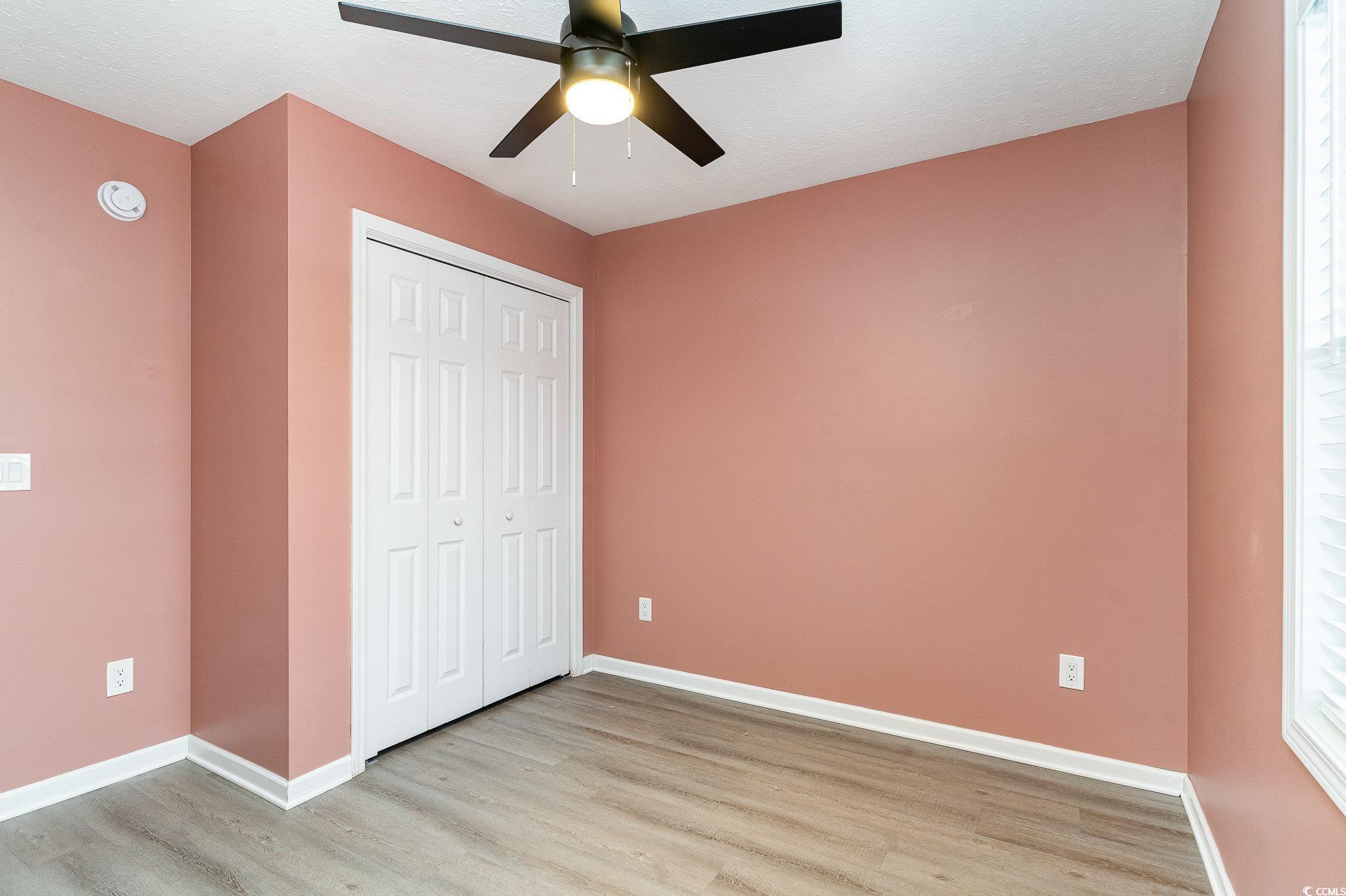 9545 Sullivan Drive Murrells Inlet, SC 29576 - Photo 9 of 30 Unfurnished bedroom with light hardwood / wood-sty