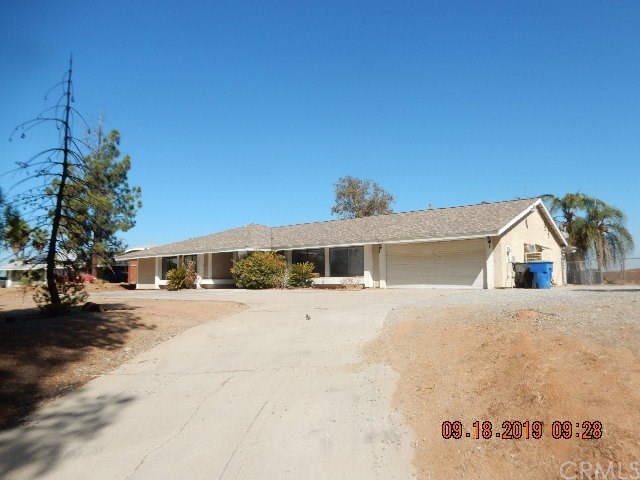 16120 Pick Place Riverside, CA 92504 - Photo 1 of 1 a view of a house with a yard