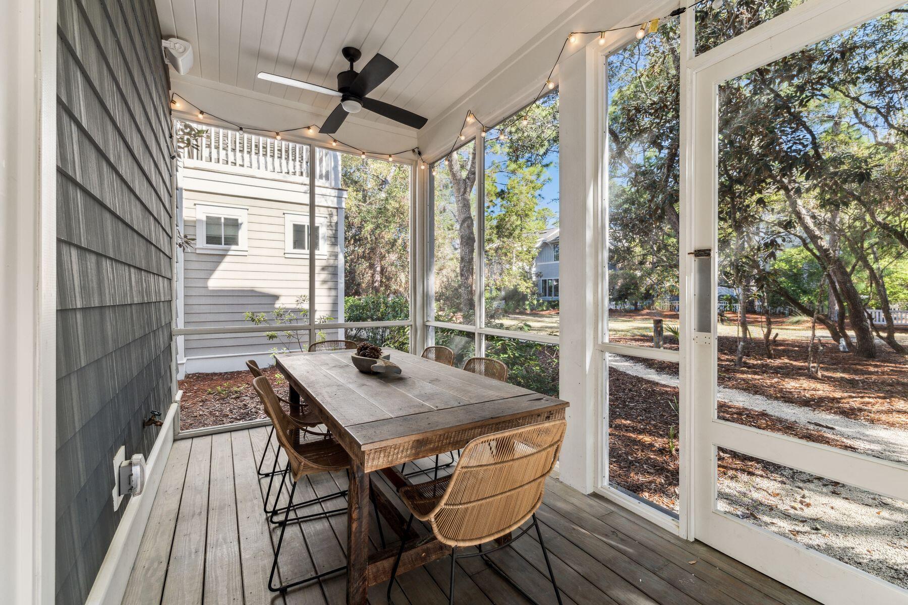 207 Anchor Rode Circle Santa Rosa Beach, FL 32459 - Photo 13 of 44 a view of a patio with a table and chairs