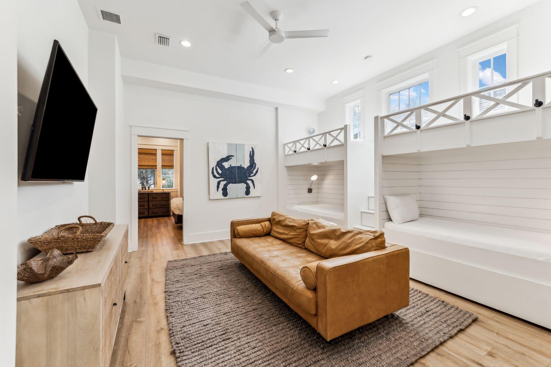 207 Anchor Rode Circle Santa Rosa Beach, FL 32459 - Photo 25 of 44 a living room with furniture and a flat screen tv