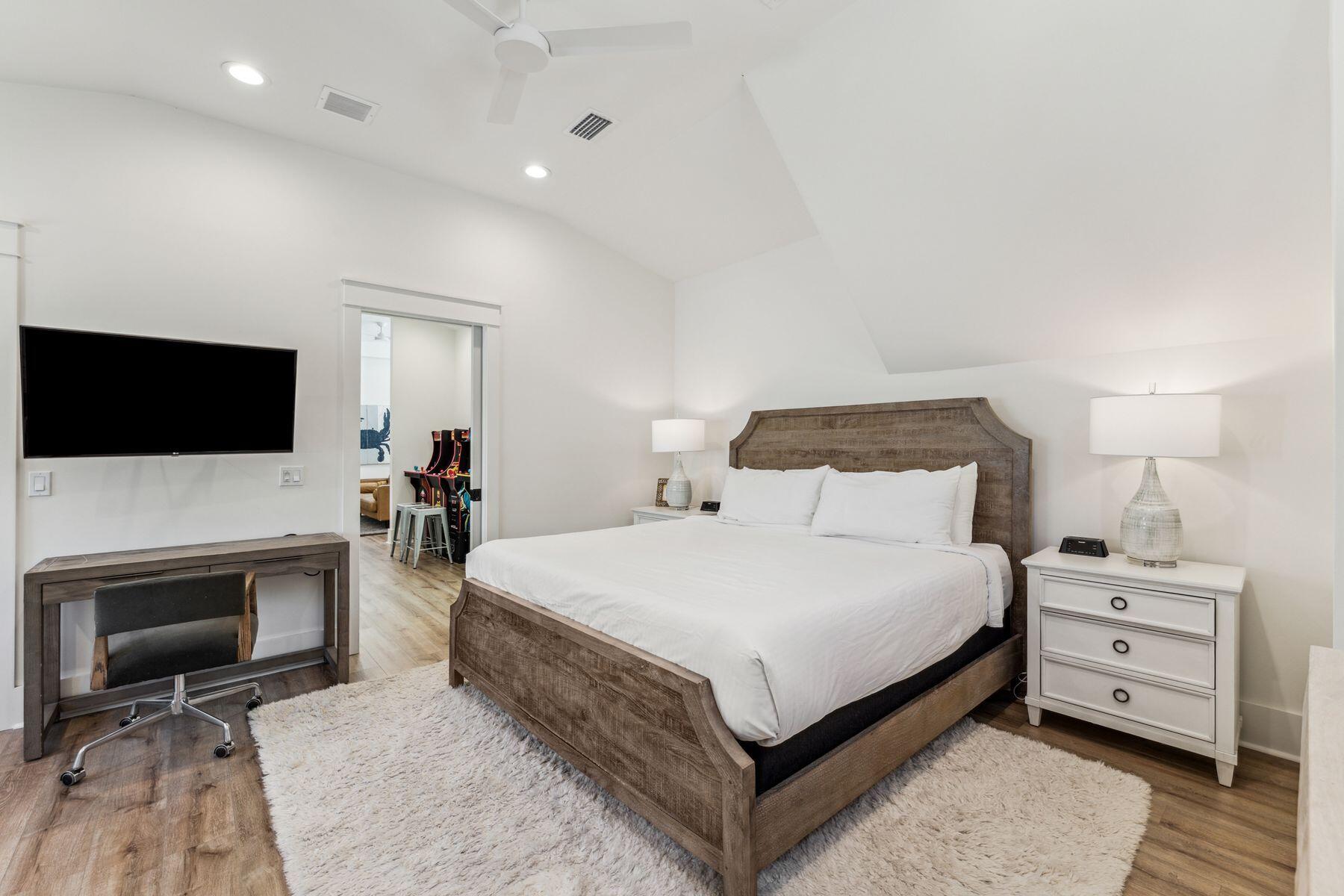207 Anchor Rode Circle Santa Rosa Beach, FL 32459 - Photo 29 of 44 a bedroom with a bed and a flat screen tv