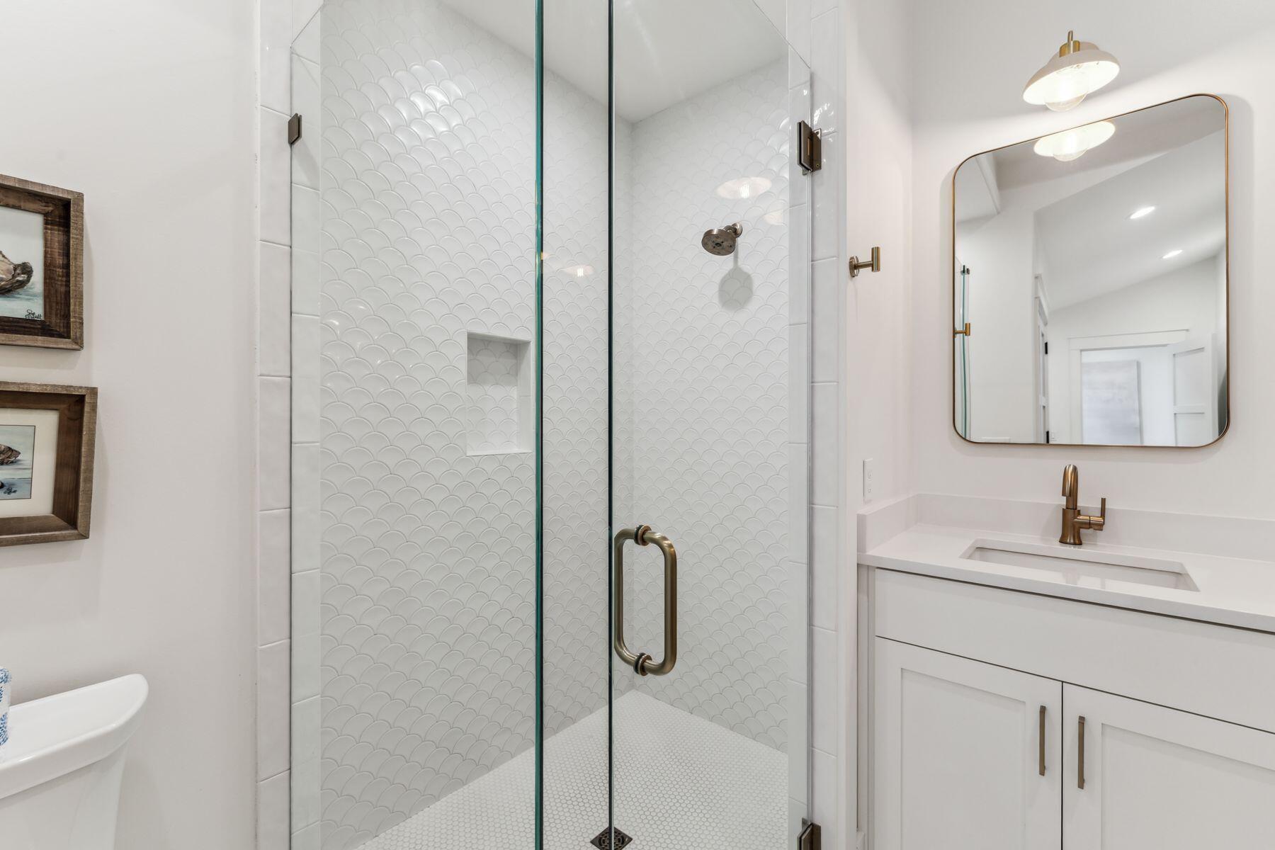 207 Anchor Rode Circle Santa Rosa Beach, FL 32459 - Photo 34 of 44 a bathroom with a shower sink vanity and mirror