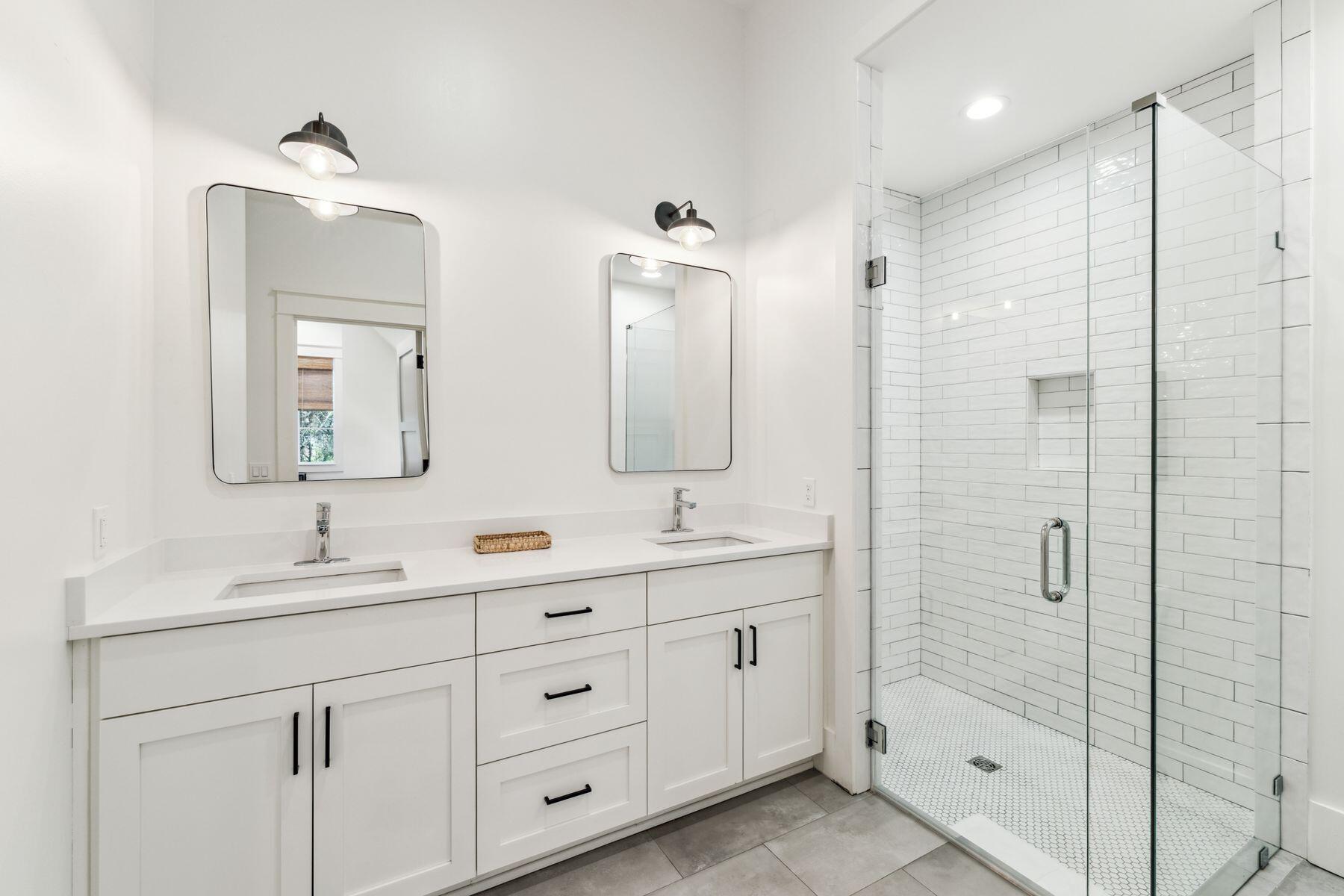 207 Anchor Rode Circle Santa Rosa Beach, FL 32459 - Photo 38 of 44 a bathroom with double vanity sinks and a mirror