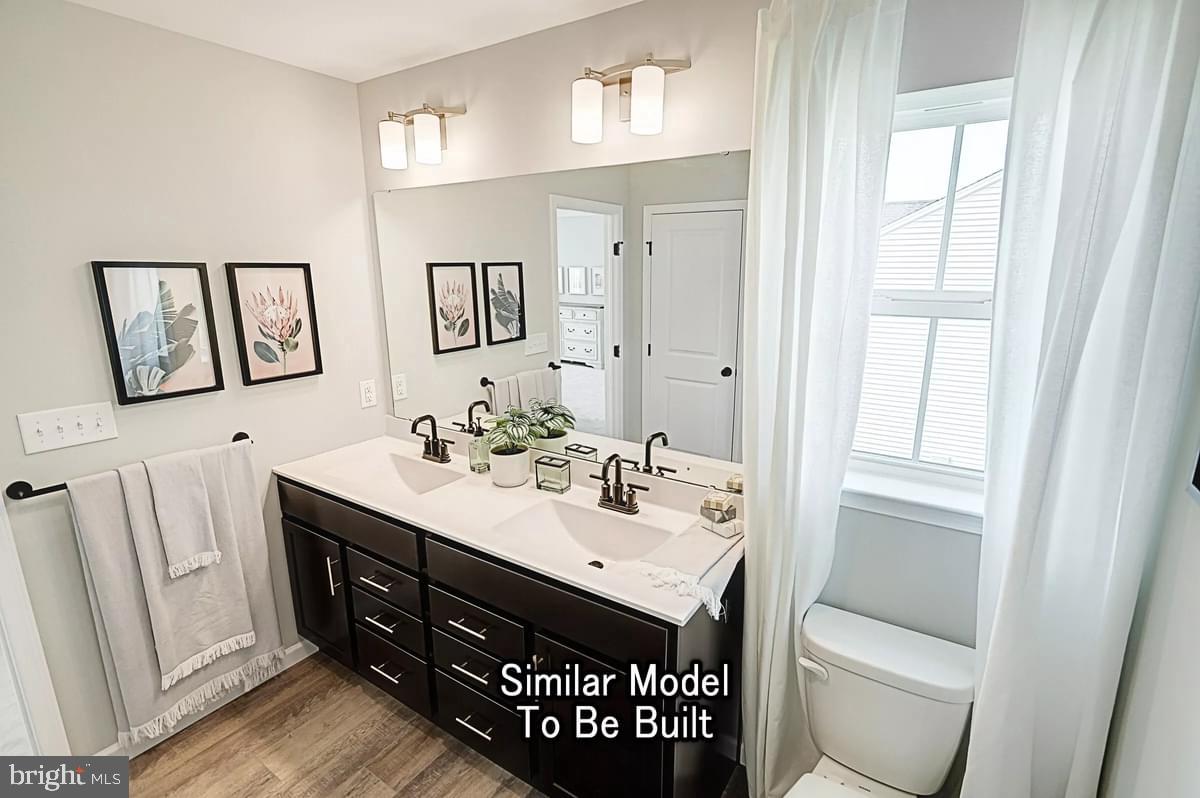 Blue Ridge Waynesboro, PA 17268 - Photo 42 of 47 a bathroom with a toilet a sink a mirror and a window