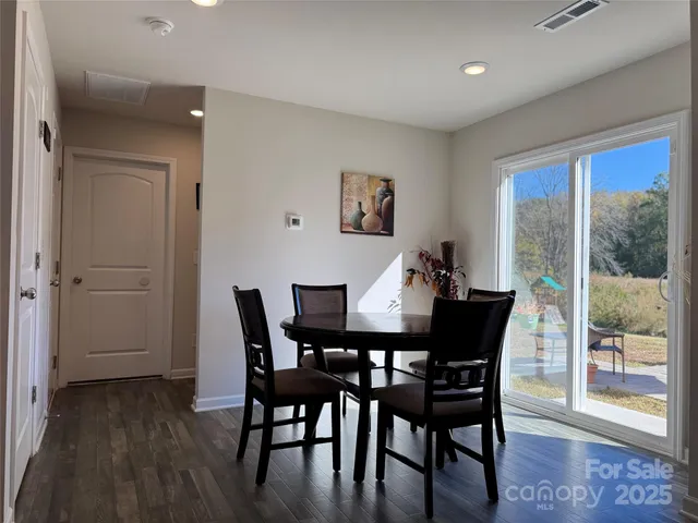 a living room with furniture a rug and a flat screen tv